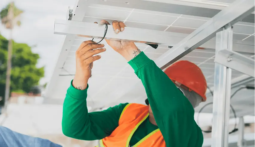 Technician servicing a residential HVAC unit